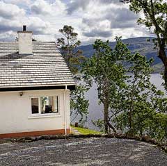 The path winds down to the cottage